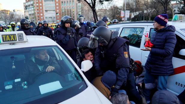 Taxi drivers disrupt traffic to protest against ride-hailing services in central Madrid