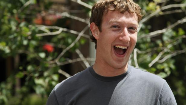File photo of Mark Zuckerberg, Facebook CEO and founder, laughing outside the Sun Valley Inn in Sun Valley