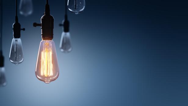 Innovation And Leadership Concept - Glowing Bulb lamp