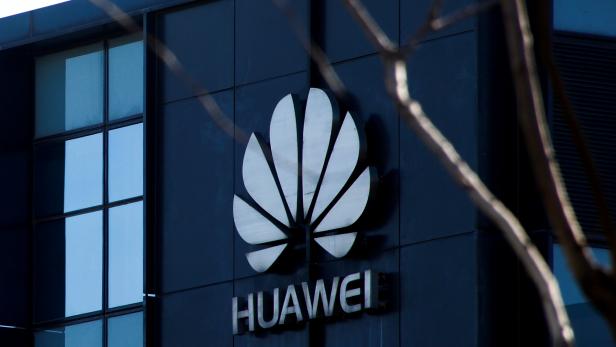FILE PHOTO: Company logo at the office of Huawei in Beijing