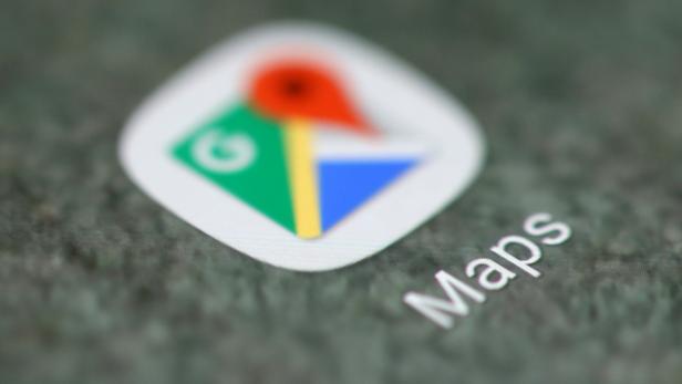 The Google Maps app logo is seen on a smartphone in this illustration