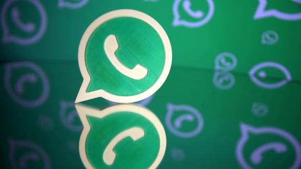 FILE PHTO: A 3D printed Whatsapp logo is seen in front of a displayed Whatsapp logo in this illustration