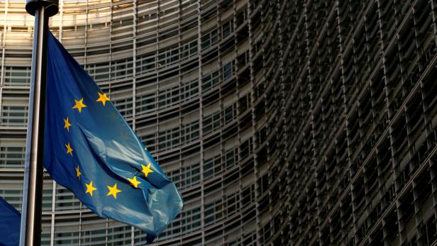 FILE PHOTO: A EU flag is seen outside the EU Commission headquarters in Brussels