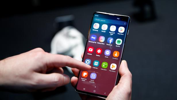 A journalist uses the new Samsung Galaxy S10 smartphone at a press event in London