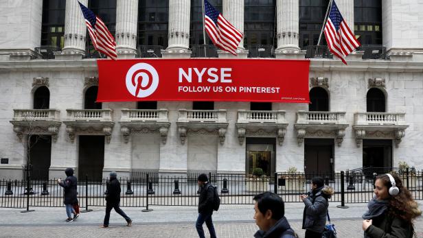 A Pinterest banner hangs on the facade of the New York Stock Exchange, (NYSE) during the morning rush in the financial district in New York