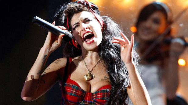 FILE PHOTO: British singer Winehouse performs at the Brit Awards at Earls Court in London