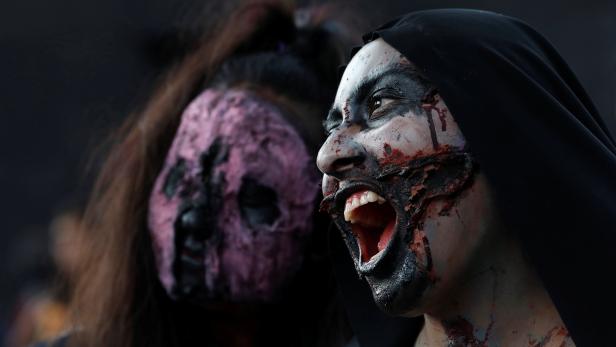 Women dressed as zombies participate in an annual Zombie Walk in Mexico City