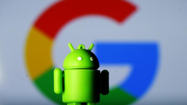 FILE PHOTO: A 3D printed Android mascot Bugdroid is seen in front of a Google logo in this illustration