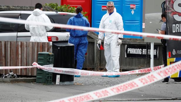 Investigators at the site of Friday's shooting outside the Linwood Mosque in Christchurch, New Zealand