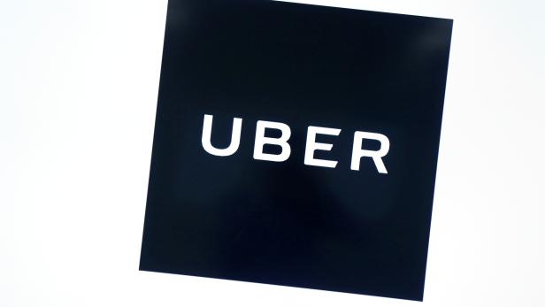 FILE PHOTO: Uber's logo is pictured at its office in Tokyo