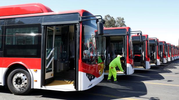 The new fleet of electric buses for public transport manufactured by China's BYD, are parked in a bus terminal in Santiago