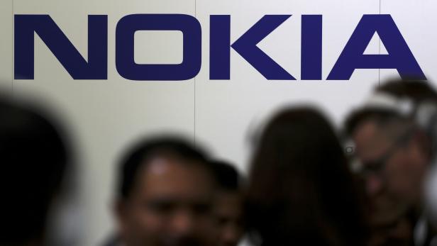 FILE PHOTO: Visitors gather outside the Nokia booth at the Mobile World Congress in Barcelona