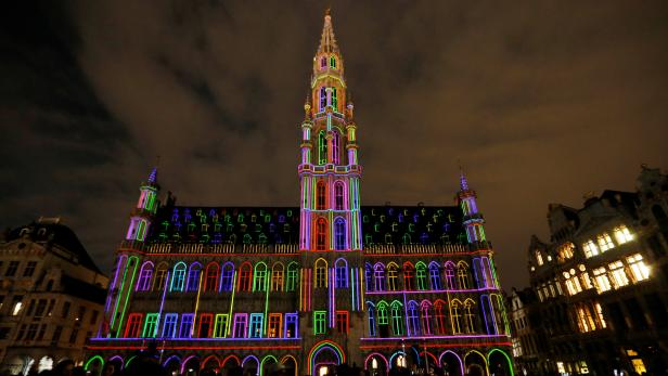 The facade of the city hall on Brussels' Grand Place is illuminated to mark the European Year of Cultural Heritage