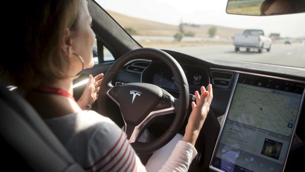 FILE PHOTO -New Autopilot features are demonstrated in a Tesla Model S during a Tesla event in Palo Alto, California