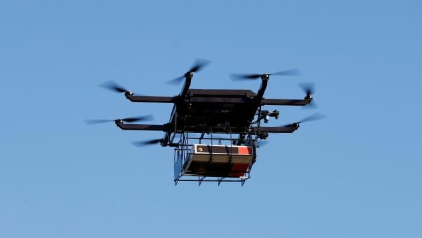 FILE PHOTO: A drone demonstrates delivery capabilities from the top of a UPS truck during testing in Lithia, Florida