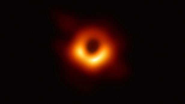 Handout of the first ever photo of a black hole, taken using a global network of telescopes, conducted by the Event Horizon Telescope (EHT) project