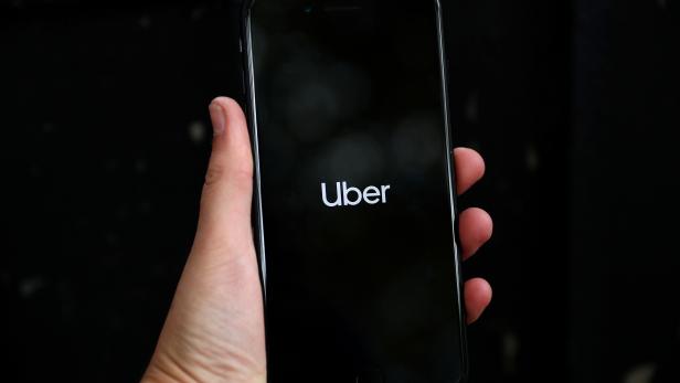 FILE PHOTO: FILE PHOTO: Uber's logo is displayed on a mobile phone in London, Britain