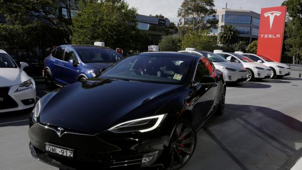 A Tesla Model S electric car is taken for a test drive at a Tesla car dealership in Sydney