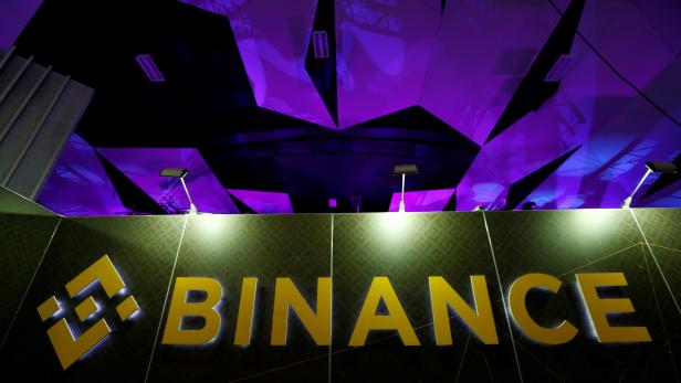 FILE PHOTO: The logo of Binance is seen on their exhibition stand at the Delta Summit, Malta's official Blockchain and Digital Innovation event promoting cryptocurrency, in St Julian's