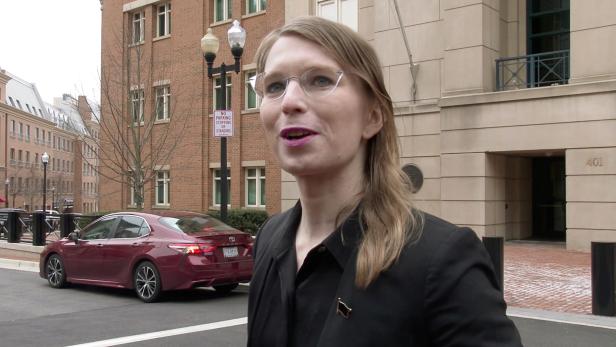 Chelsea Manning speaks to reporters outside the U.S. federal courthouse shortly before appearing before a federal judge and being taken into custody for contempt of court in Alexandria, Virginia