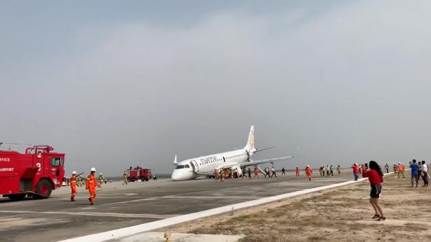 View after Myanmar National Airlines flight UB103 landed without a front wheel at Mandalay International Airport in Tada-U