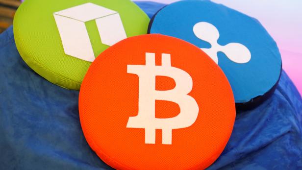 FILE PHOTO: The Bitcoin logo is seen on a pillow on display at the Consensus 2018 blockchain technology conference in New York City