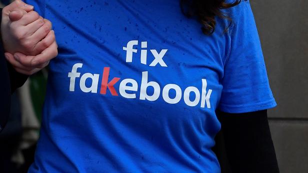 A campaigner from a political pressure group protests as founder and CEO of Facebook Mark Zuckerberg failed to attend a meeting on fake news held by Parliament's Digital, Culture Media and Sport committee in London