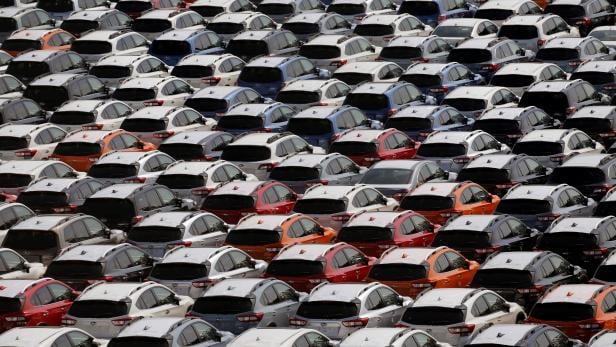 Newly manufactured cars of the automobile maker Subaru await export in a port in Yokohama