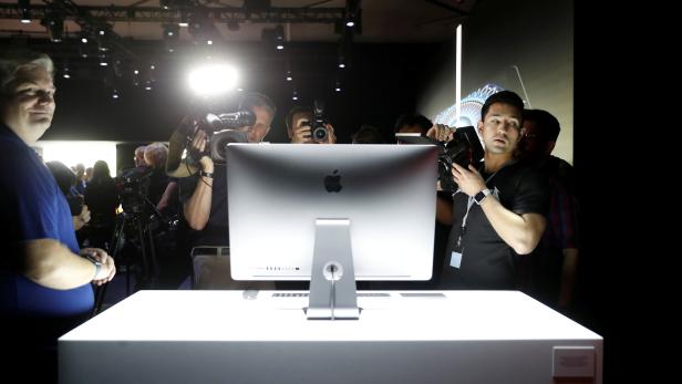 FILE PHOTO: Members of the media photograph a prototype iMac Pro during the annual Apple Worldwide Developer Conference (WWDC) in San Jose