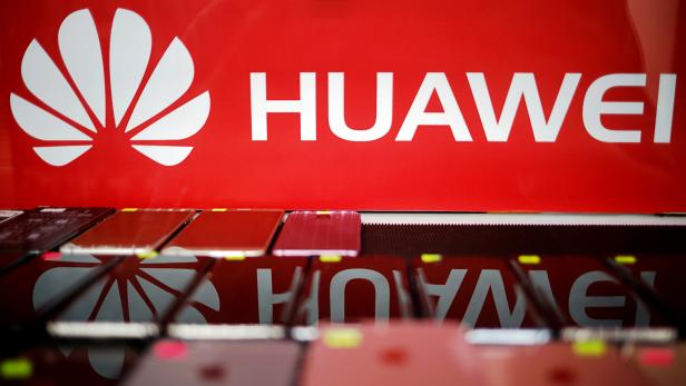 FILE PHOTO: The logo of Huawei is pictured at a mobile phone shop in Singapore