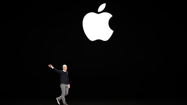 Tim Cook, CEO of Apple, waves to attendees during an Apple special event at the Steve Jobs Theater in Cupertino