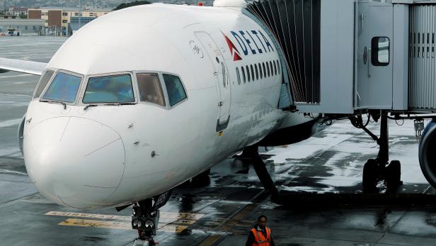 FILE PHOTO: A Delta Airlines plane is seen at a gate in San Diego