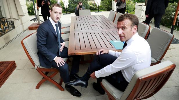 FILE PHOTO: Facebook's founder and CEO Mark Zuckerberg meets with French President Emmanuel Macron at the Elysee Palace after the "Tech for Good" summit, in Paris