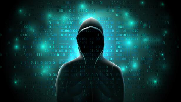 Silhouette of a hacker on a background with binary code and lights, hacking of a computer system, theft of data