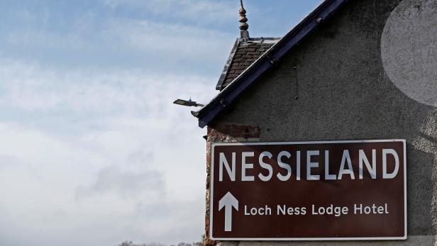 A sign for Nessieland is seen on a building near Loch Ness, Scotland