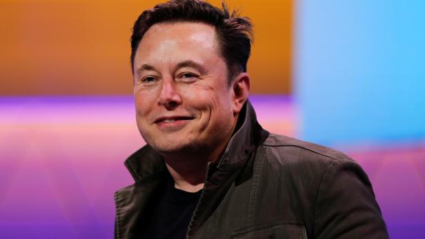 SpaceX owner and Tesla CEO Elon Musk smiles during a conversation with legendary game designer Todd Howard at the E3 gaming convention in Los Angeles