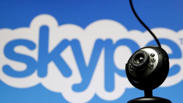 FILE PHOTO: A web camera is seen in front of a Skype logo in this photo illustration taken in Zenica