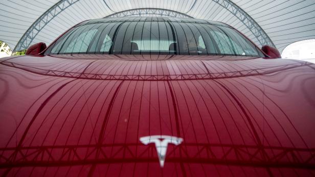 FILE PHOTO: IIHS technician Floyd demonstrates front crash prevention test on Tesla Model 3 at IIHS-HLDI Vehicle Research Center in Ruckersville, Virginia