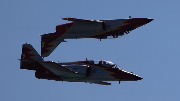 Casa C-101 Aviojets from the Spanish Air Force aerobatic group Patrulla Aguila fly during an international aerial and naval military exhibition in Rota