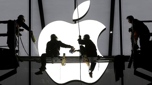 File photo of workers preparing for the opening of an Apple store in Hangzhou