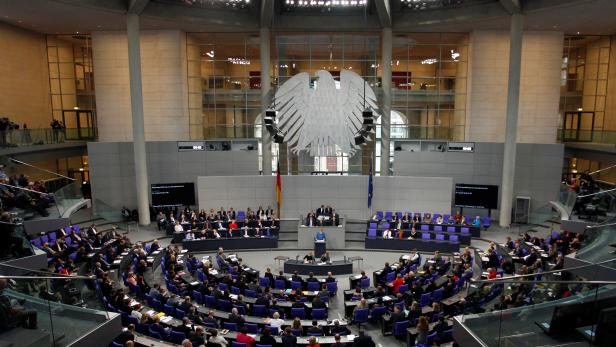 German Chancellor Angela Merkel speaks to members of Germany's lower house of parliament Bundestag in Berlin