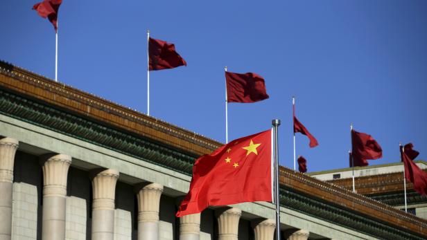 FILE PHOTO: Chinese flag waves in front of the Great Hall of the People in Beijing