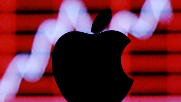 FILE PHOTO: Picture illustration of a 3D printed Apple logo in front of a displayed stock graph