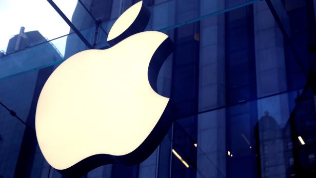 FILE PHOTO: The Apple Inc. logo is seen hanging at the entrance to the Apple store on 5th Avenue in New York