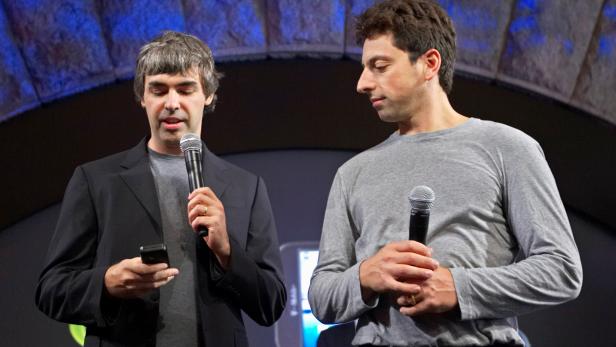 FILE PHOTO: Founders of Google show new G1 phone running Android software in New York