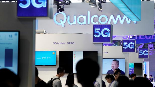 FILE PHOTO: Signs of Qualcomm and 5G are pictured at Mobile World Congress (MWC) in Shanghai