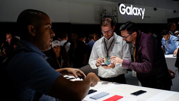 People test new devices during the launch event of the Samsung Galaxy Note 10 at the Barclays Center in Brooklyn, New York