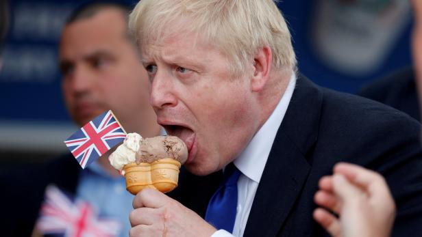 FILE PHOTO: Prime Minister Boris Johnson eats ice cream in Barry Island