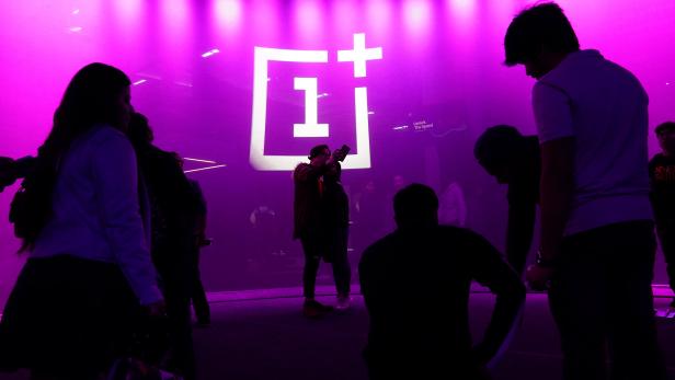 The OnePlus logo is projected onto a wall during a launch event for the new OnePlus 6T in the Manhattan borough of New York