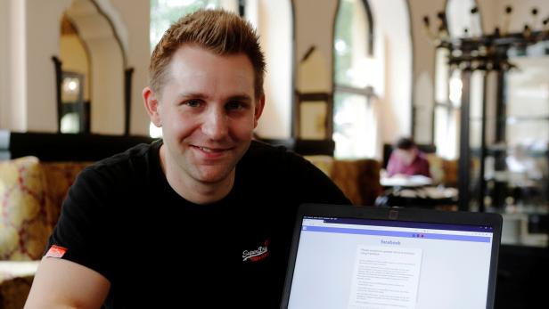 FILE PHOTO: Austrian lawyer and privacy activist Schrems displays his Facebook account's updated terms page during a Reuters interview in Vienna